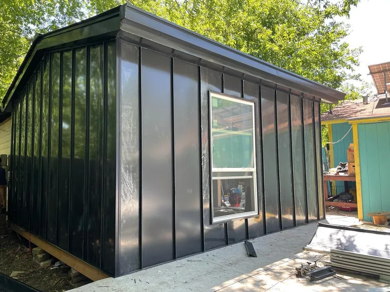 Black standing seam metal wall panels for Roof Inspection in Southborough